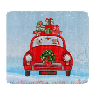 Maltese Dog In Car With Santa Claus Cutting Board