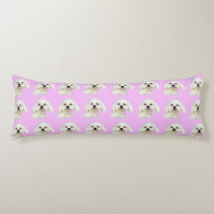 Maltese puppy on pink body cushion