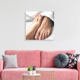 Man and a Woman's Foot On a White Bedsheet Canvas Print