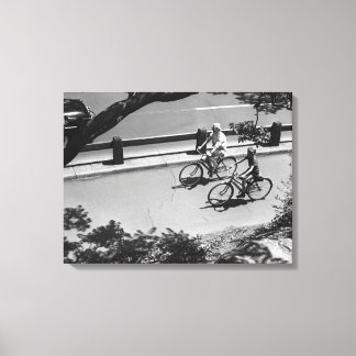 Man and Boy Cycling Canvas Print