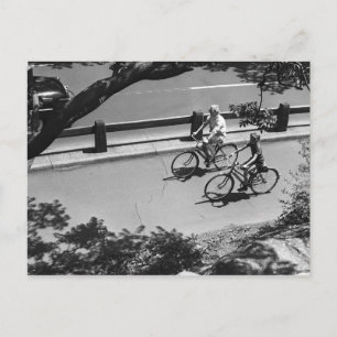 Man and Boy Cycling Postcard