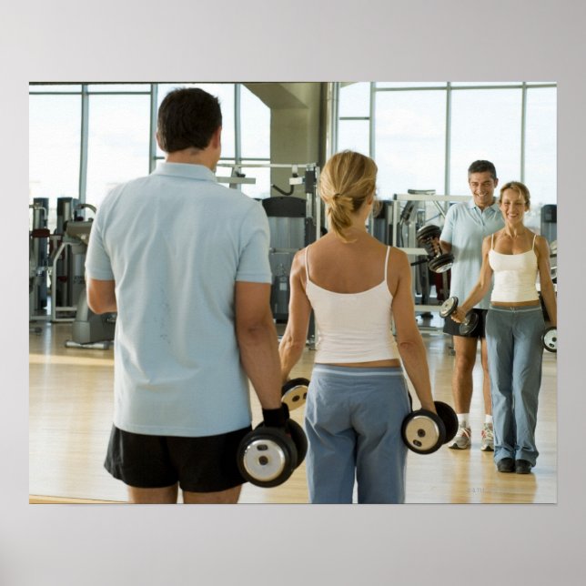 Man and woman lifting hand weights in front of a poster (Front)