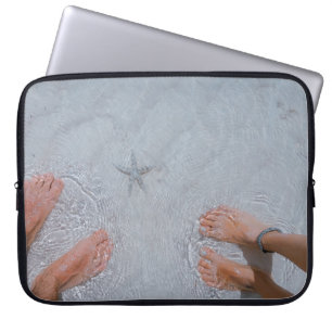 Man and woman on seashore nearby starfish laptop sleeve