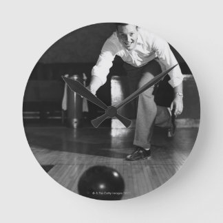 Man Bowling Round Clock