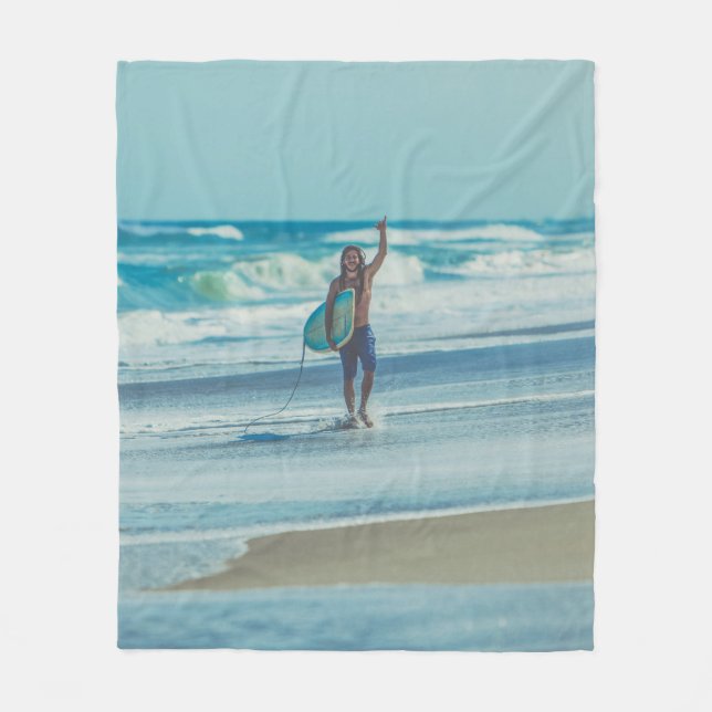 Man carrying surfboard at beach fleece blanket (Front)
