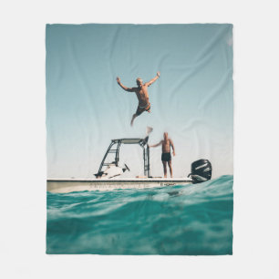 Man diving on pool fleece blanket