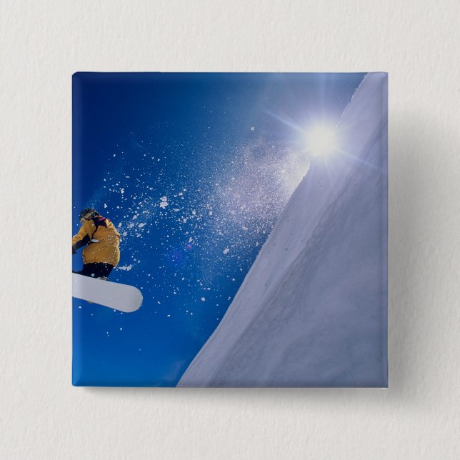 Man flying through the air on a snowboard with 15 cm square badge (Front)