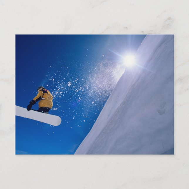 Man flying through the air on a snowboard with postcard (Front)