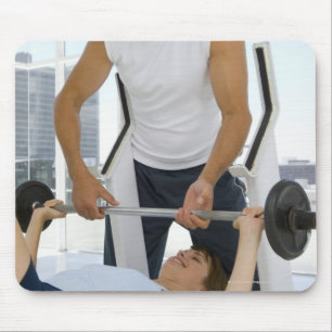 Man helping woman with weightlifting mouse mat