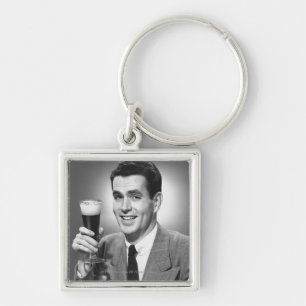 Man holding glass of beer in studio B&W Key Ring