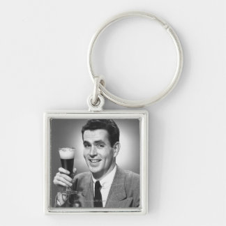 Man holding glass of beer in studio B&W Key Ring