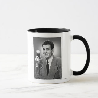 Man holding glass of beer in studio B&W Mug