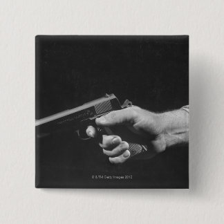 Man Holding Gun 15 Cm Square Badge