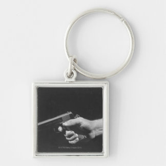 Man Holding Gun Key Ring