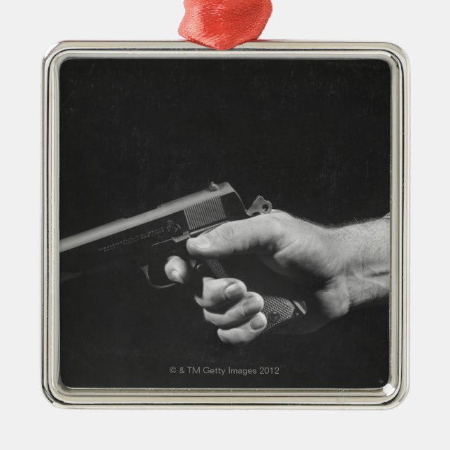 Man Holding Gun Metal Tree Decoration (Front)