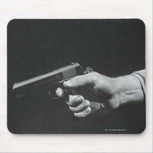 Man Holding Gun Mouse Mat
