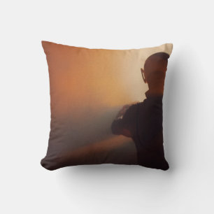MAN IN BLACK JACKET WEARING BLACK CAP CUSHION