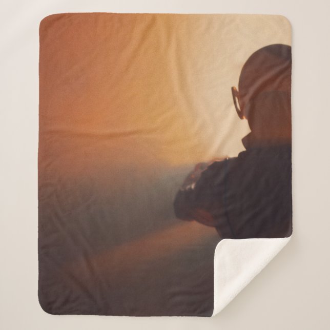 MAN IN BLACK JACKET WEARING BLACK CAP SHERPA BLANKET (Front)