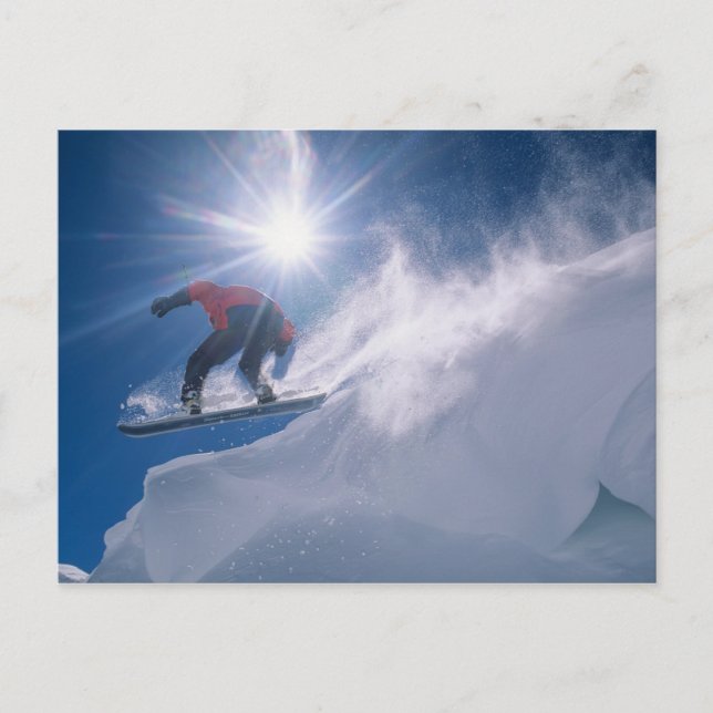 Man jumping off a large cornince on a snowboard postcard (Front)