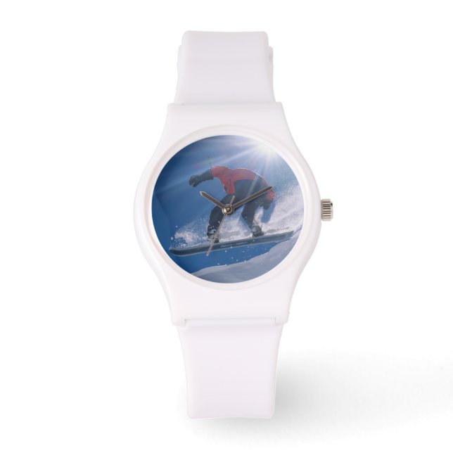 Man jumping off a large cornince on a snowboard watch (Front)