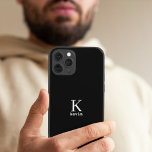 Man monogram name personalised simple black  iPhone 15 case<br><div class="desc">Modern simple masculine looking stylish iPhone case with black and white trendy typography (changeable colours).            Personalised gift for him: dad,  father,  husband,  son,  boyfriend,  groom,  best man,  groomsman,  business executive.</div>