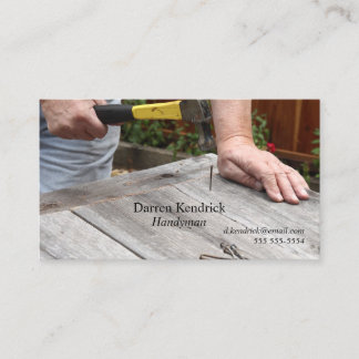 Man nails boards in backyard business card