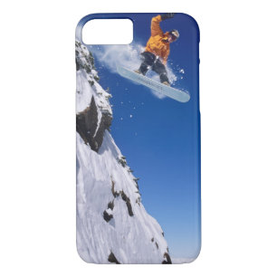 Man on a snowboard jumping off a cornice at iPhone 8/7 case