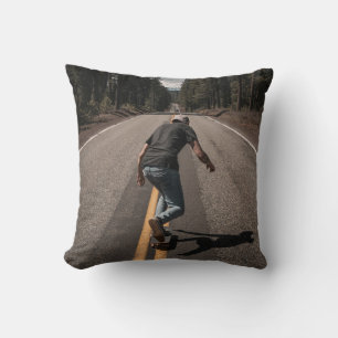 Man playing skateboard on road in the morning cushion