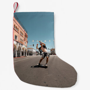 Man playing skateboard small christmas stocking