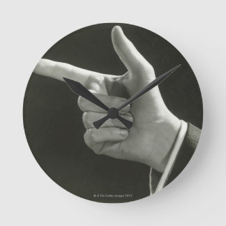 Man Pointing Round Clock