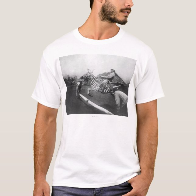 Man Riding Zebra Jumping Fence Photograph T-Shirt (Front)