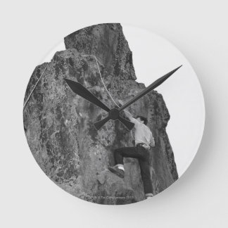 Man Rock Climbing Round Clock
