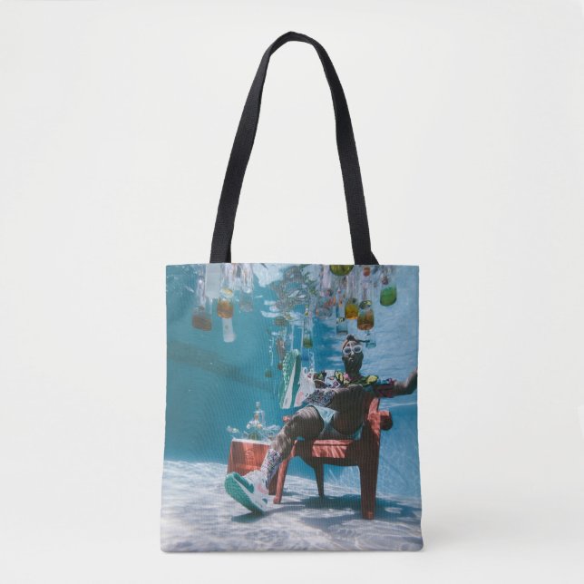 Man sitting on chair underwater with floating bott tote bag (Front)