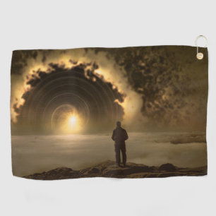 Man standing on a hill looking at a large golf towel