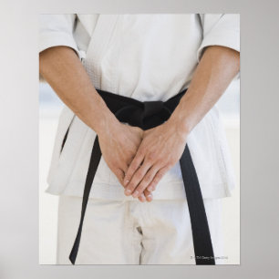 Man wearing karate black belt poster