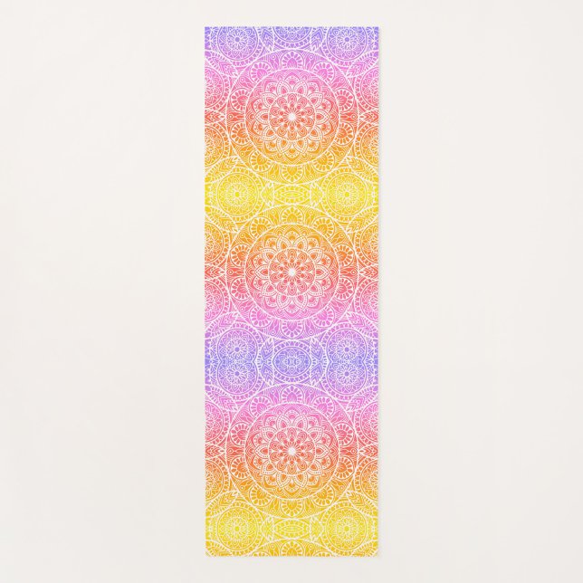 Mandala Pink Yoga Mat  (A yoga mat with a gradient of colors from violet to yellow, with a pattern of white mandalas.)