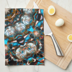 Mandala that looks like a crater in bright colours tea towel