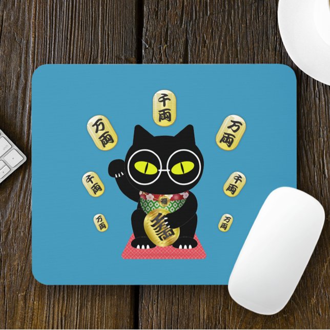 Maneki Neko Lucky Poilue Mouse Mat (A Maneki Neko Lucky Poilue Mouse Pad is on the table.)
