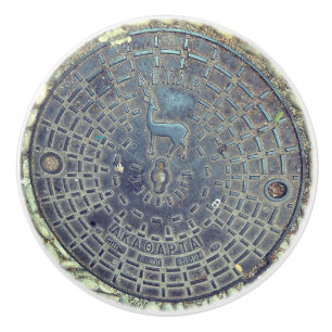 Manhole cover and cobblestone road ceramic knob