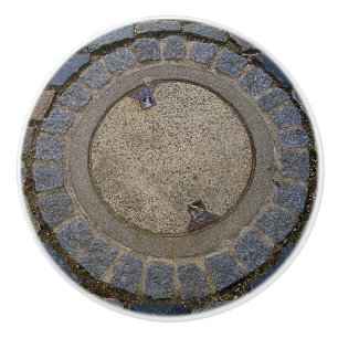 Manhole cover and cobblestone road ceramic knob