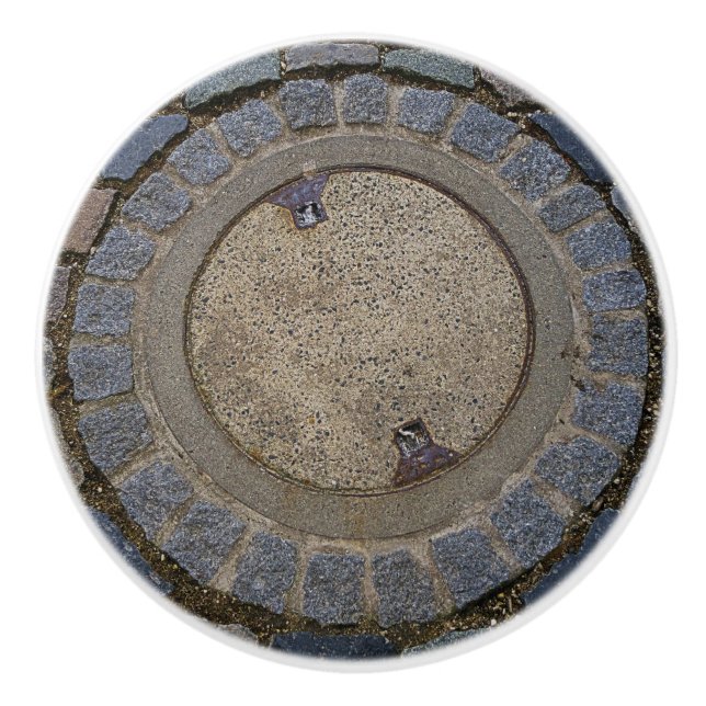 Manhole cover and cobblestone road ceramic knob (Front)