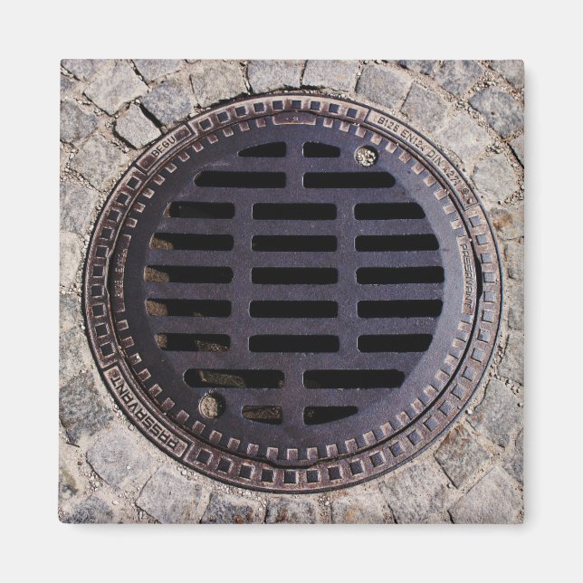 Manhole cover and cobblestone road magnet (Front)