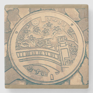 Manhole cover and cobblestone road stone coaster