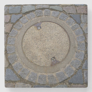 Manhole cover cobble stone road grey brown coaster