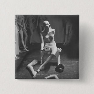 Mannequin with leg and arm removed 15 cm square badge