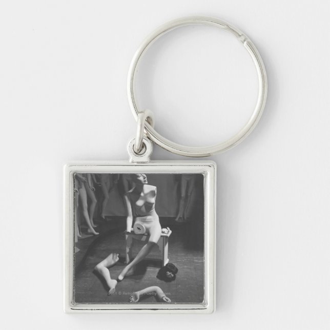 Mannequin with leg and arm removed key ring (Front)