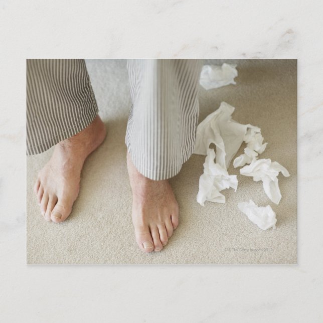 Man's feet surrounded by crumpled tissues postcard (Front)