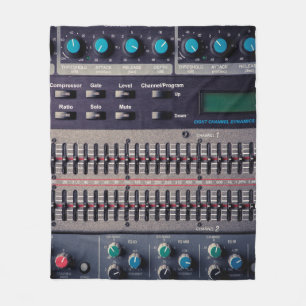 Many buttons on a sound mixer in a recording studi fleece blanket