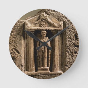Marble and sandstone votive stele with female figu round clock