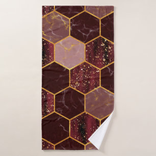 Marble hexagon seamless texture with gold bath towel